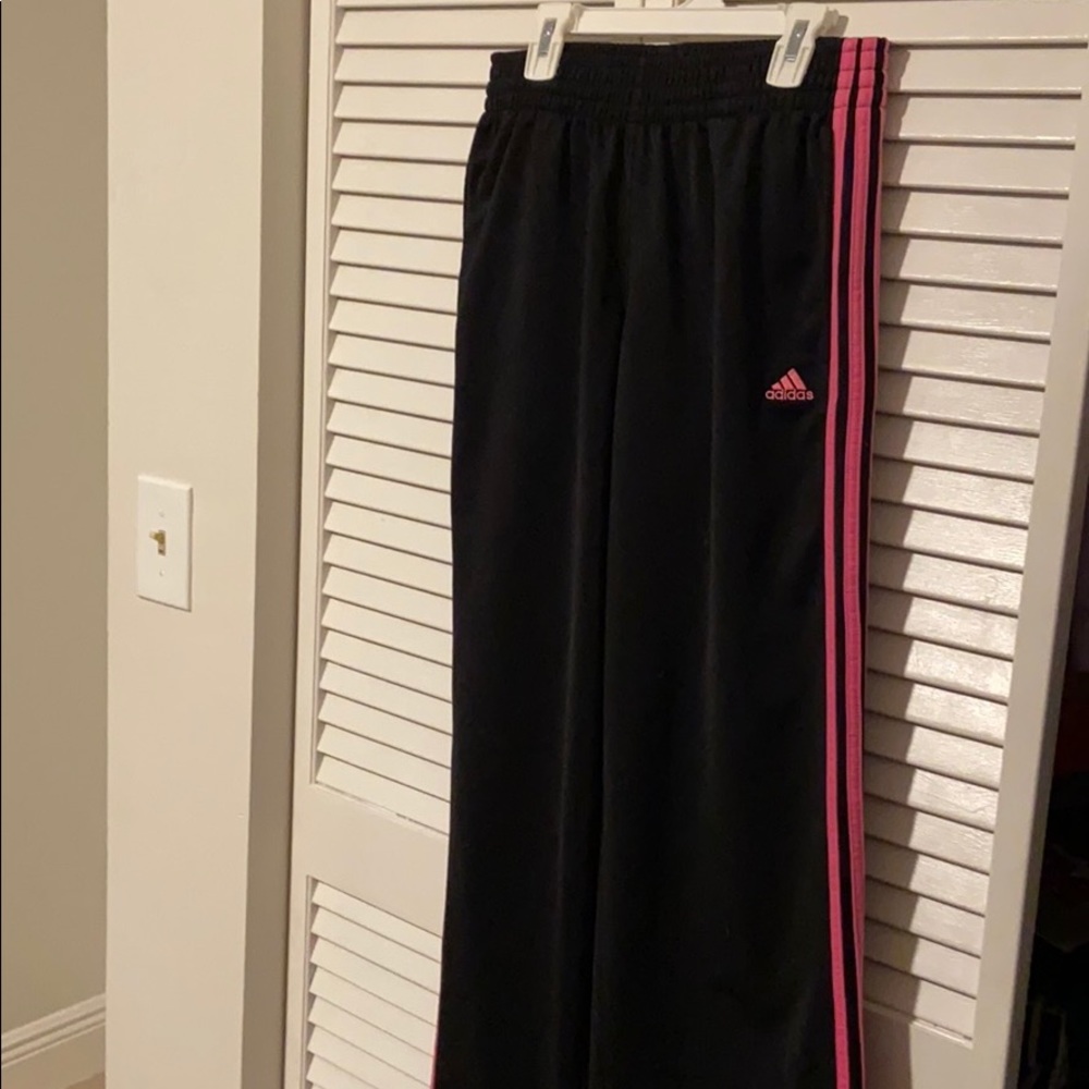 Adidas women’s track pants. Black w/pink stripes.